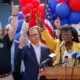 Philadelphia Mayor Cherelle Parker (right) raises a finger for one Philadelphia, united, next to Pennsylvania Gov. Josh Shapiro in July.