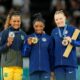 Rebeca Andrade of Brazil, Simone Biles and Jade Carey of the United States pose for a photo during the medal ceremony for the vault on the first day of gymnastics event finals during the Paris 2024 Olympic Summer Games at Bercy Arena.