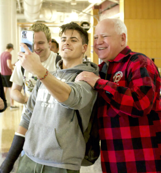 Minnesota Gov. Tim Walz has his photo taken with young fans.