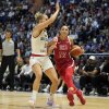 United States' Diana Taurasi (right) drives around Germany's Leonie Fiebich during a women's exhibition basketball game between the United States and Germany in London on July 23, 2024.